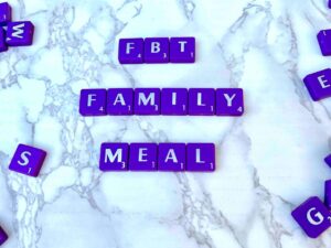 FBT Family Meal [Image description: Purple scrabble tiles spelling "FBT Family Meal"]