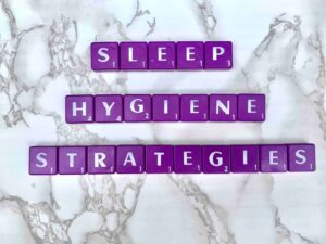 Sleep hygiene strategies in Los Angeles, California [Image description: purple scrabble tiles spelling "Sleep Hygiene Strategies"]