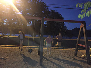Empowering Parents To Support Children With Eating Disorders [Image description: a photo of 3 children on swings] Represents young adult and teen children whose parents are supporting them in California