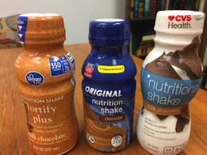 Store brand nutritional supplements - Kroger, Rite-Aid, and CVS for Eating Disorder Recovery [ image description: photo of 3 nutritional supplement shake bottles from CVS, Kroger, and Rite-Aid]