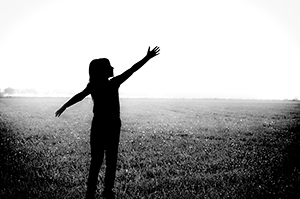 FBT Depression and Self-Esteem [image description: silhouette of a child with arms out in a field]