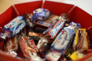 Halloween candy for fear food exposure in FBT [Image description: photo of candy in an orange bucket] 