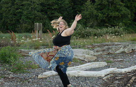 exercise as joyful movement in eating disorder recovery in California [Image description: a larger bodied woman dances outside] Represents a potential woman in treatment for an eating disorder in Los Angeles, California