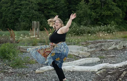 exercise as joyful movement in eating disorder recovery in California [Image description: a larger bodied woman dances outside] Represents a potential woman in treatment for an eating disorder in Los Angeles, California