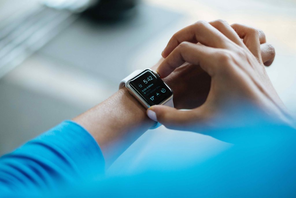 Cutting Down on Food and Fitness Tracking in Los Angeles, California [Image description: photo of a person looking at their wearable smart watch] Represents a person in counseling for an eating disorder in Los Angeles, California