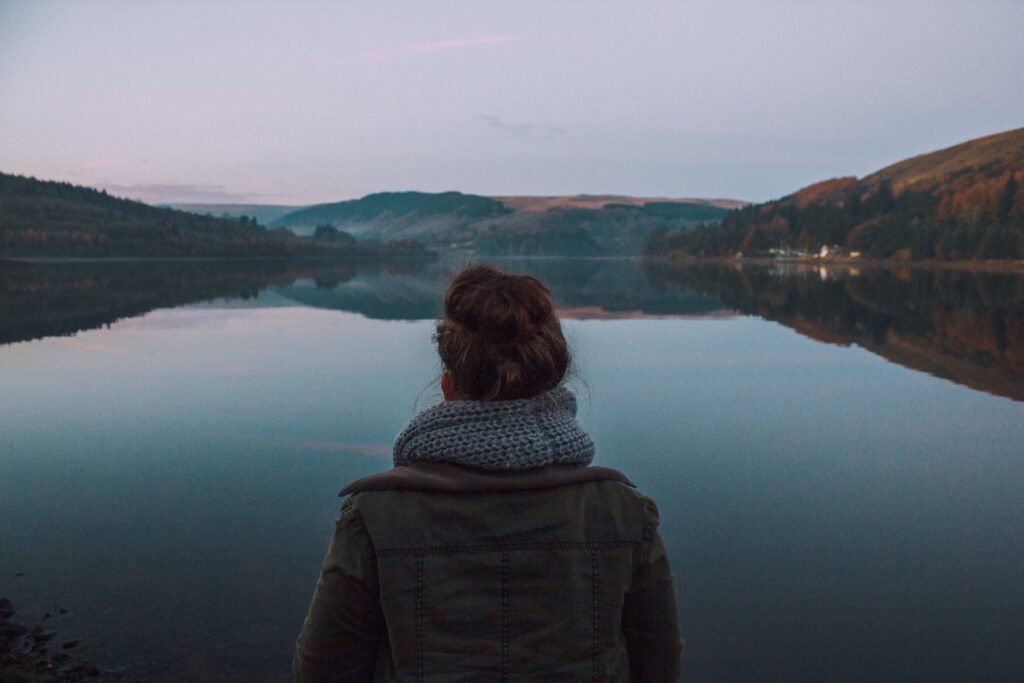 Anxiety During Anxious Times in Los Angeles, California [Image description: image of the back of a person looking at a calm body of water] Represents a person getting counseling for anxiety in Los Angeles, California