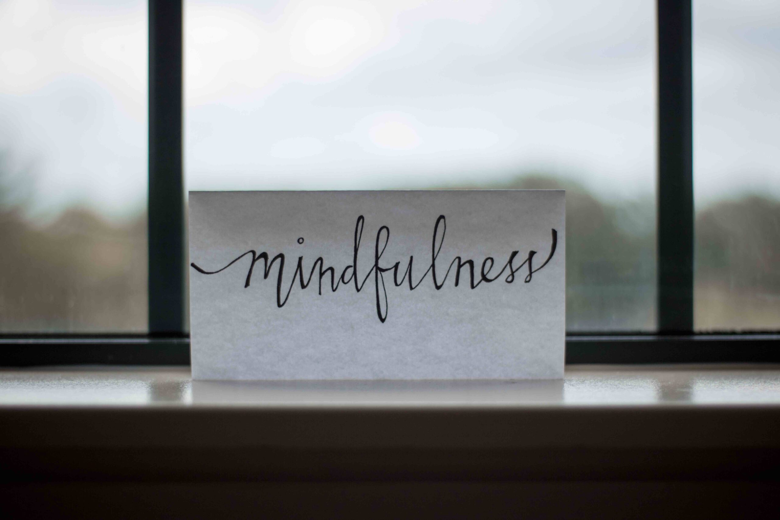 Image Description: Paper in window that reads "Mindfulness" Adjunctive therapies that go alongside FBT for Eating Disorders