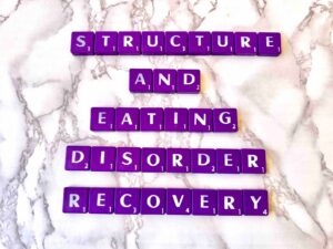 Structuring Eating Disorder Recovery in Los Angeles, California [Image description: photo of purple scrabble tiles that spell "Structure and Eating Disorder Recovery"]
