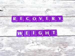 How We Set Recovery Weight in Los Angeles, California [Image description: photo of purple scrabble tiles spelling "Recovery Weight"]