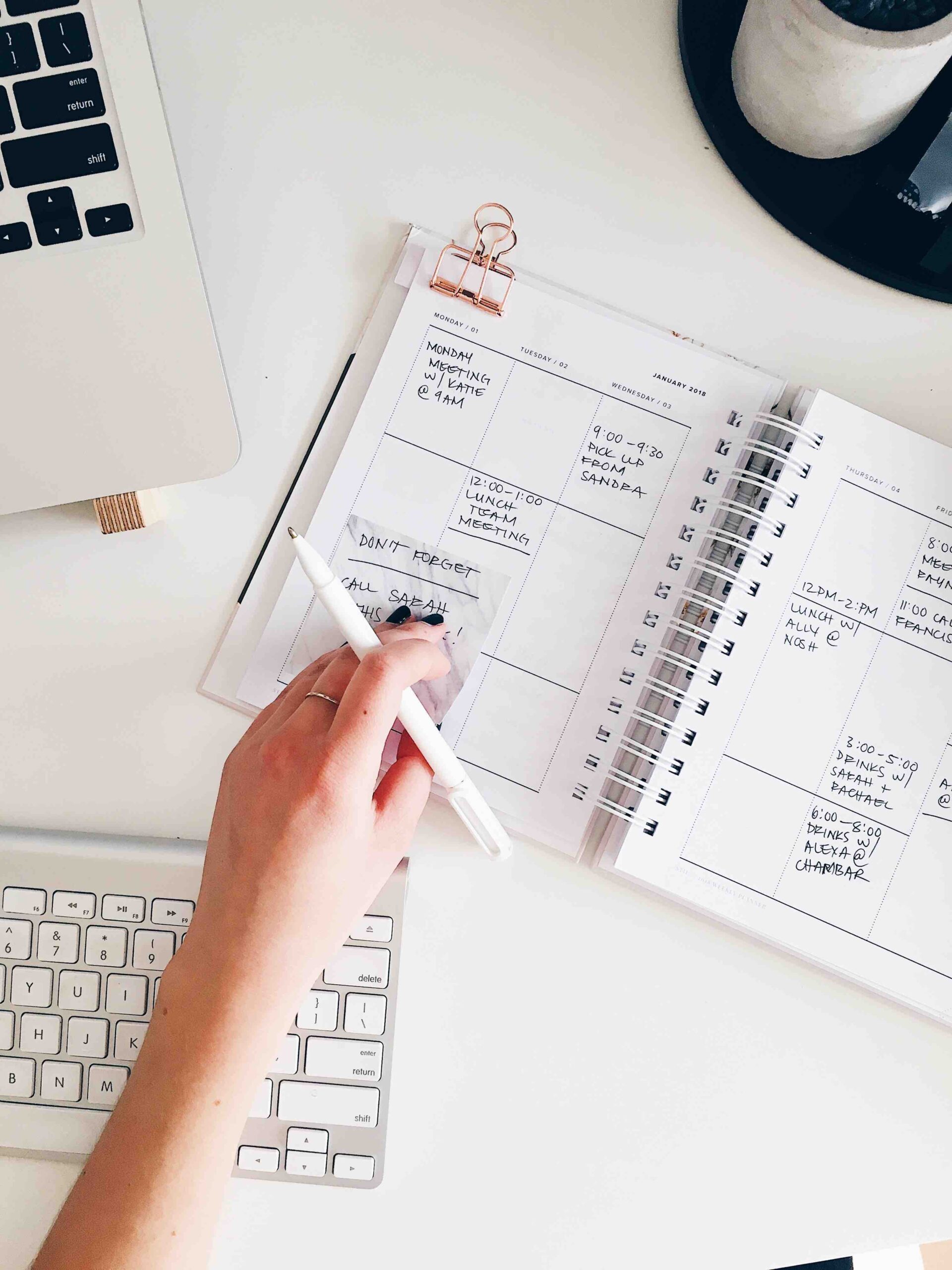 Structuring Your Eating Disorder Recovery Environment [Image description: hand visible writing in planner] represents a client in eating disorder recovery in Los Angeles, California writing a meal plan