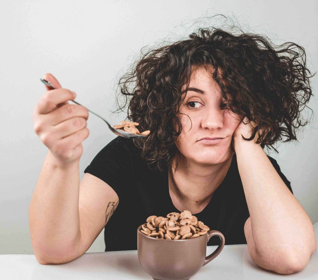 Supporting a Loved One with ARFID [Image description: woman looking disgusted at bowl of cereal] Represents a potential client with ARFID seeking treatment in Los Angeles, CA