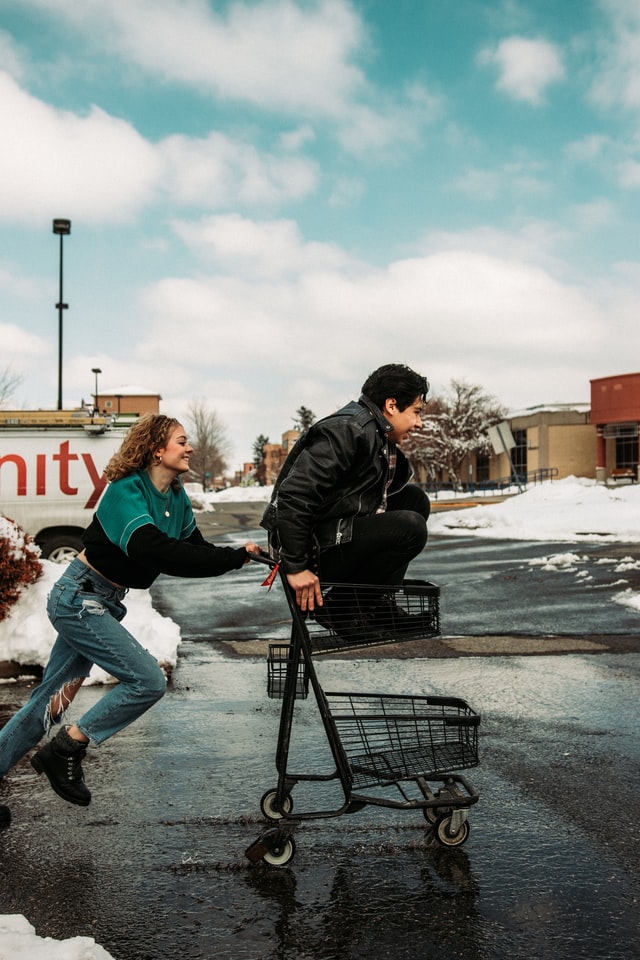 Parenting During FBT [Image description: photo of one teen pushing another in a shopping cart] Represents a potential family with teens getting help for an eating disorder in Los Angeles, California