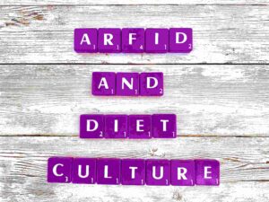 ARFID and diet culture in Los Angeles, California [Image description: Purple scrabble tiles spelling "ARFID and Diet Culture"]