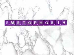Emetophobia [Image description: purple scrabble tiles spelling "emetophobia"] Represents a potential person with specific fear of vomiting or vomiting phobia in Los Angeles, California