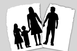 Family-Based Treatment with separated and divorced families [Image description: a black and white drawing of a family of 4 with a tear between the 2 parents] Representing a possible family seeking FBT in Los Angeles, CA