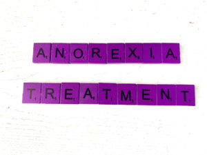 Anorexia Treatment in Los Angeles, CA [Image description: purple scrabble tiles that spell "Anorexia Treatment"]