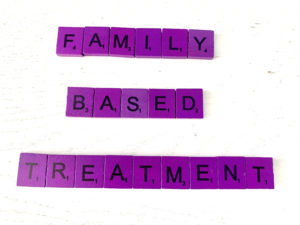 Family-Based Treatment for Eating Disorders [Image description: purple scrabble tiles that spell out "Family-based treatment"