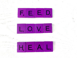 Feed, Love, Heal motto for Family-Based Treatment [Image description: scrabble tiles spelling out "Feed, Love, Heal"]