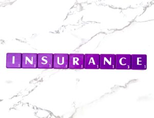 Insurance for Eating Disorder Counseling in California [Image description: purple scrabble tiles spelling "Insurance"]