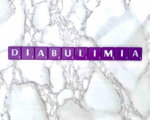 Diabulimia in Los Angeles, California [Image description: photo of purple scrabble tiles spelling "diabulimia"] 