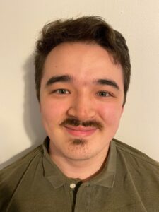 Kai Basler-Chang, predoctoral extern at Eating Disorder Therapy LA in Los Angeles, California, providing low-cost therapy [Image description: photo of a young adult male smiling with a mustache and dark hair]