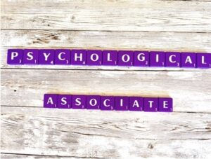 Psychological Associate in Los Angeles, California [Image description: Purple scrabble tiles spelling "Psychological associate"] 