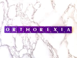 Orthorexia Treatment in Los Angeles, California [Image description: purple scrabble tiles spelling "Orthorexia"] 