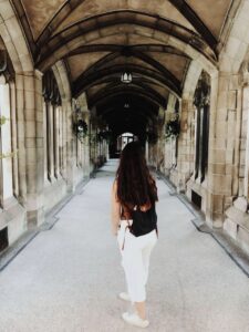 Six Months of College Readiness for Students with Eating Disorders [Image description: photo of a woman walking through a gothic building viewed from the rear] Represents a potential college student with an eating disorder in California seeking therapy.