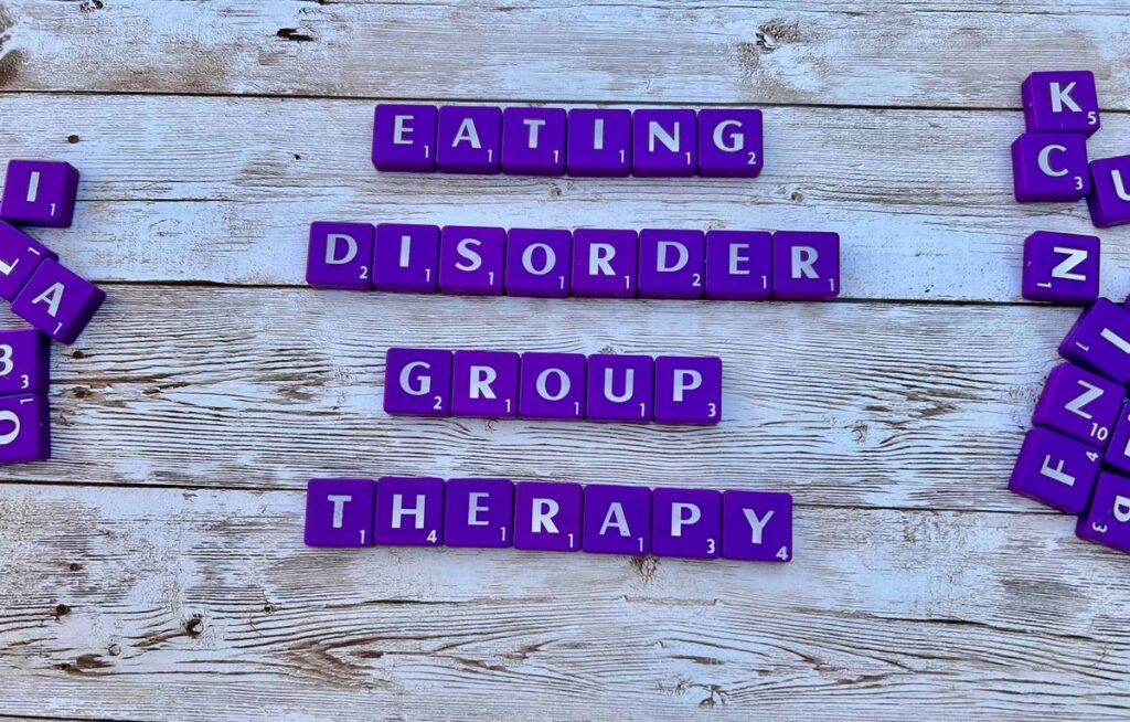 Eating Disorder Group Therapy in California and Online [Image description: purple scrabble tiles spelling "Eating Disorder Group Therapy"]