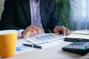 Insurance companies engaging in wealth extraction through big telehealth platforms | 94539| 94544 | 94555 | 94586 business person with a tablet looking at the income of big telehealth